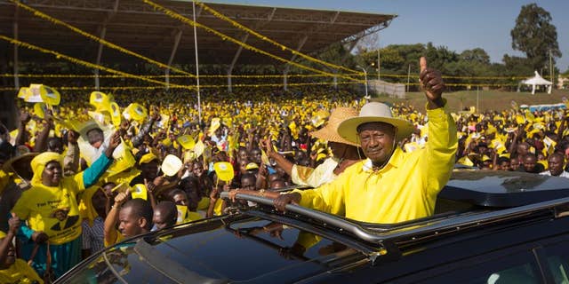 Feb. 16, 2016: Uganda's long-time President Yoweri Museveni waves to supporters from the sunroof of his vehicle as he arrives for an election rally at Kololo Airstrip in Kampala, Uganda.