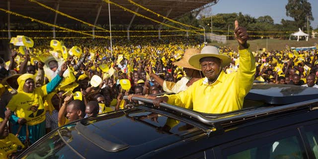 Feb. 16, 2016: Uganda's long-time President Yoweri Museveni waves to supporters from the sunroof of his vehicle as he arrives for an election rally at Kololo Airstrip in Kampala, Uganda.