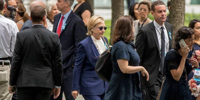 Democratic presidential candidate Hillary Clinton arrives to attend a ceremony at the National September 11 Memorial, in New York, Sunday, Sept. 11, 2016, on the 15th anniversary of the Sept. 11 attacks. (AP Photo/Andrew Harnik)