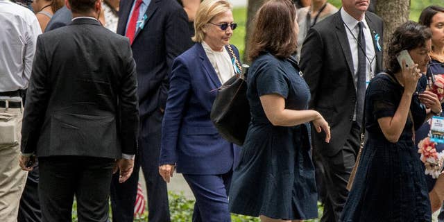 Democratic presidential candidate Hillary Clinton arrives to attend a ceremony at the National September 11 Memorial, in New York, Sunday, Sept. 11, 2016, on the 15th anniversary of the Sept. 11 attacks. (AP Photo/Andrew Harnik)