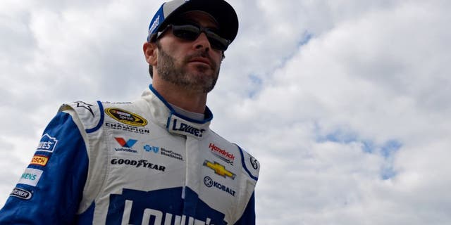 HOMESTEAD, FL - NOVEMBER 19: Jimmie Johnson, driver of the #48 Lowe's Chevrolet, walks through the garage area during practice for the NASCAR Sprint Cup Series Ford EcoBoost 400 at Homestead-Miami Speedway on November 19, 2016 in Homestead, Florida. (Photo by Jared C. Tilton/Getty Images)