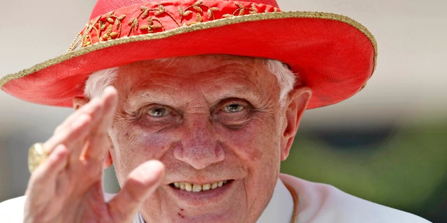 FILE - This June 30, 2010 file photo shows Pope Benedict XVI blessing faithful as he leaves St. Peter's square at the Vatican at the end of his weekly general audience. Benedict XVI always cast himself as the reluctant pope, a shy bookworm who preferred solitary walks in the Alps to the public glare and the majesty of Vatican pageantry. But once in office, he never shied from charting the Catholic Church on the course he thought it needed — a determination reflected in his stunning announcement Monday, Feb. 11, 2013, that he would be the first pope to resign since 1415. (AP Photo/Pier Paolo Cito, files)
