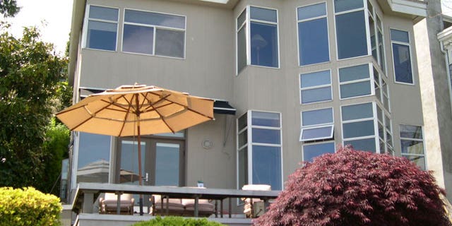 In this undated photo provided by the King County Dept. of Assessments, the $1.2 million waterfront home where prosecutors say a Seattle chiropractor and his wife lived while claiming welfare assistance is seen.