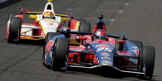 In this May 19, 2013 photo, Marco Andretti, leads Helio Castroneves, of Brazil, into the first turn on the second day of qualifications for the Indianapolis 500 auto race at the Indianapolis Motor Speedway in Indianapolis. Graham Rahal and Andretti have all the ingredients the IndyCar Series has been craving. They have famous family names, have reached Victory Lane and seem to enjoy playing up their growing rivalry. (AP Photo/Darron Cummings)