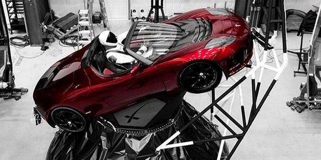 Website Tracks Musks Tesla Roadster And Dummy Pilots