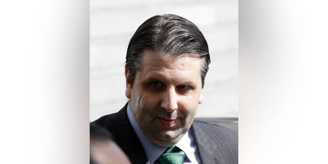In this March 10, 2015, injured U.S. Ambassador to South Korea Mark Lippert leaves after being discharged from Seoul's Severance Hospital in Seoul, South Korea. South Korean police said Friday that they had arrested a 33-year-old jobless man for allegedly making an online threat to kill the U.S. ambassador in Seoul. The man allegedly left an English message vowing to "kill" Mark Lippert with "nuclear poisoning" on the website of the White House on July 8, police said in a statement. (AP Photo/Lee Jin-man)