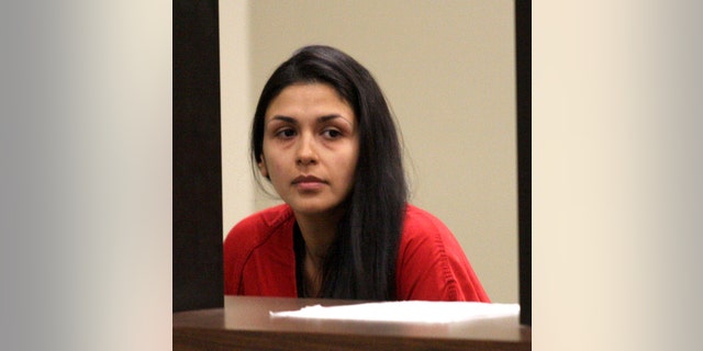 Lida Sharaf waits in the holding area at Superior Court for arraignment on felony and misdemeanor child abuse charges in Pleasanton, Calif., Thursday, April 25, 2013. The attorney for two Northern California women facing charges that they endangered infants' lives by binding them too tightly in swaddling blankets says the women did not intend to hurt the babies and maintain what they did was not abuse. Timothy Rien, the attorney for Nazila and Lida Sharaf, says the sisters contend they did not commit child abuse. Rien spoke Thursday, when the women were arraigned in a Contra Costa County courtroom on three counts of felony child abuse and neglect and four counts of misdemeanor child abuse and neglect. (AP Photo/Bay Area News Group, Jim Stevens)
