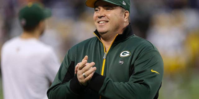 ADVANCE FOR WEEKEND EDITIONS, JULY 4-6 - FILE - In this Dec. 30, 2012 file photo, Green Bay Packers head coach Mike McCarthy walks on the field before an NFL football game against the Minnesota Vikings, in Minneapolis. After family and coaching, a children's hospital might be McCarthy’s biggest passion _ even if it means running into the occasional Bears fan. (AP Photo/Charlie Neibergall, File)