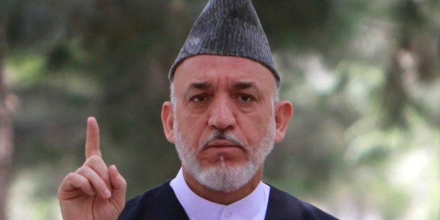 Afghan President Hamid Karzai speaks during a gathering with high ranking Afghan military officials at the presidential palace in Kabul, Afghanistan on Tuesday, July 26, 2011. Afghanistan's president has told his country's soldiers and police that they face a difficult year ahead as they take on more security responsibilities, but he wants them to push ahead so that Afghanistan can eventually defend itself. (AP Photo/Musadeq Sadeq)