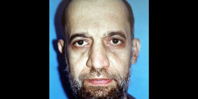FILE - In this undated file photo, Mohammed al-Zawahri is seen in police custody in Cairo, Egypt. The brother of al-Qaida leader Ayman al-Zawahri has sanctioned violence against the West in retaliation from French-led campaign against militants in Mali. (AP Photo/Asharq al-Awsat, File)