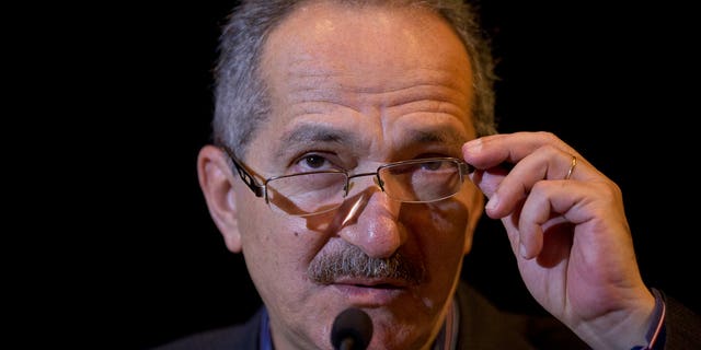 Brazil's Sports Minister Aldo Rebelo adjusts his glasses during a news conference in Sao Paulo, Brazil, Monday, Oct. 28, 2013. Rebelo is not expecting waves of protests during the World Cup next year, saying the Brazilian people will be more worried about celebrating the tournament than complaining of its cost. (AP Photo/Andre Penner)
