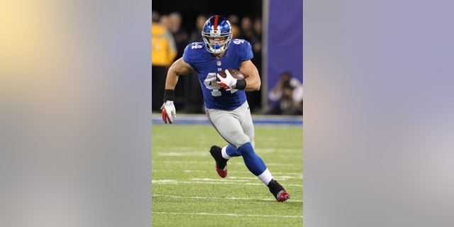 New York Giants' Peyton Hillis (44) rushes during the second half of an NFL football game against the Minnesota Vikings Monday, Oct. 21, 2013 in East Rutherford, N.J. (AP Photo/Peter Morgan)