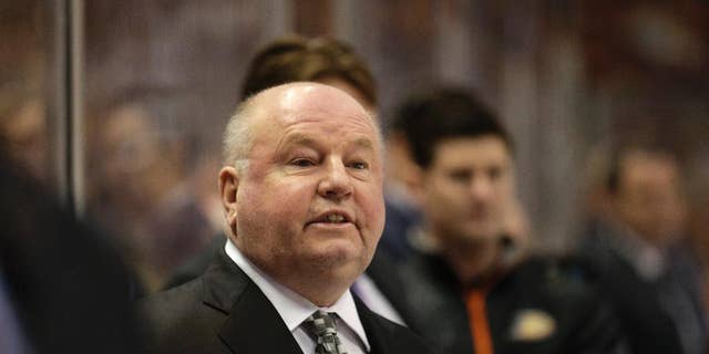 FILE - In this Wednesday, April 8, 2015 file photo, Anaheim Ducks head coach Bruce Boudreau coaches his team during the first period of an NHL hockey game against the Dallas Stars in Anaheim, Calif. Bruce Boudreau has agreed to terms to coach the Minnesota Wild. Wild general manager Chuck Fletcher announced the move Saturday night, May 7, 2016. Boudreau was fired by Anaheim two days after the four-time Pacific Division champions' first-round exit from the playoffs. He was 208-104-40 in parts of five seasons with the Ducks after going 201-88-40 in parts of five seasons with the Washington Capitals. (AP Photo/Jae C. Hong, File)