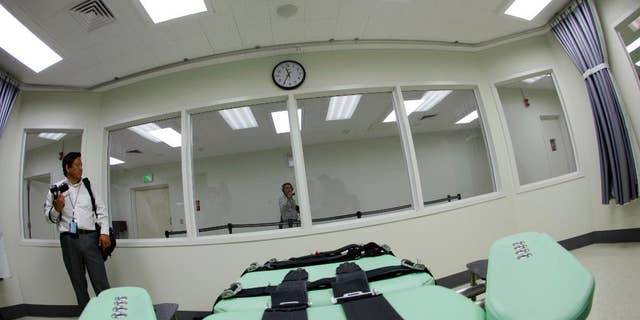 FILE - In this Sept. 21, 2010 file photo, the view a condemned inmate would have from a table inside the death chamber is shown during a tour of the new lethal injection facility at San Quentin State Prison in San Quentin, Calif. Death penalty supporters are setting the stage for a November showdown over whether to speed up executions in California or do away with them entirely. They'll be holding some 10 news conferences up and down the state on Thursday, May 19, 2016. (AP Photo/Eric Risberg, File)
