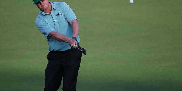 Charley Hoffman hits on the first fairway during the first round of the Masters golf tournament Thursday, April 9, 2015, in Augusta, Ga. (AP Photo/Chris Carlson)