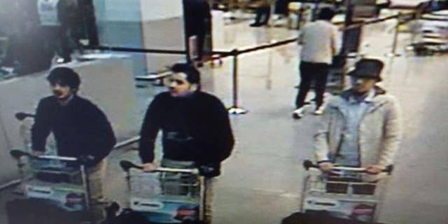 A surveillance image taken at the Zaventem airport before the attack. The men believed to be the suicide bombers, on the left, wore gloves on their left hands.