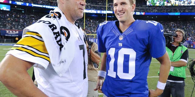 Pittsburgh Steelers quarterback Ben Roethlisberger (7) and New York Giants quarterback Eli Manning (10) talk after the Giants beat the Steelers 20-16 in a preseason NFL football game, Sunday, Aug. 10, 2014, in East Rutherford, N.J. (AP Photo/Bill Kostroun)