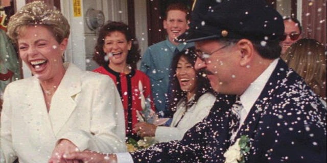 Toni Tennille (L) and Daryl Dragon singing duo "The Captain and Tennille", after renewing wedding vows in 1995.