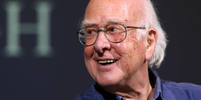 FILE - In this file photo dated Friday, Oct. 11, 2013, Britain's Professor Peter Higgs smiles during a press conference in Edinburgh, Scotland, Friday, Oct. 11, 2013. A group of 13 Nobel laureates, including Peter Higgs, have written an open letter published in a British national newspaper Saturday June 11, 2016, urging U.K. referendum voters to remain inside the European Union, warning that Britain will lose funding, global influence and access to expertise if the nation votes to leave the 28-nation bloc.(AP Photo/Scott Heppell, FILE)