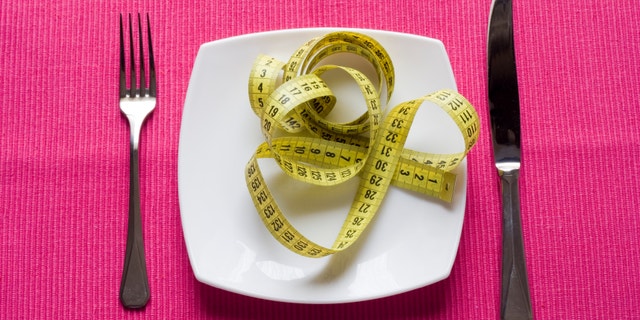 healthy eating concept in a pink background