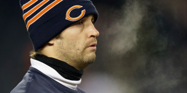 Injured Chicago Bears quarterback Jay Cutler walks around the field during team warmups before an NFL football game between the Bears and the Dallas Cowboys, Monday, Dec. 9, 2013, in Chicago. (AP Photo/Nam Y. Huh)