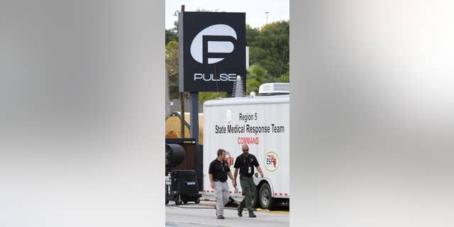 The investigation continues at Pulse nightclub in Orlando, Fla., Sunday , June 19, 2016. It's been one week since the Pulse shootings claimed 50 lives. (Joe Burbank/Orlando Sentinel via AP)