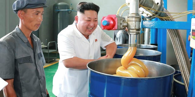 Kim Jong Un smiles during a visit to the Chonji Lubricant Factory.