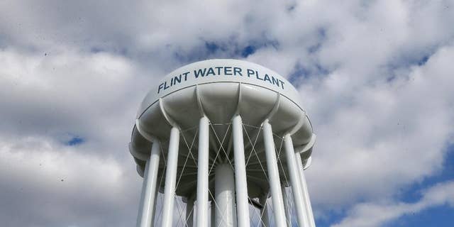 In this photo taken March 21, 2016, the Flint Water Plant water tower is seen in Flint, Mich. President Barack Obama next week will make his first trip to Flint, Mich. since the impoverished city was found to have lead-tainted drinking water, the White House said Wednesday, April 27, 2016.   (AP Photo/Carlos Osorio)