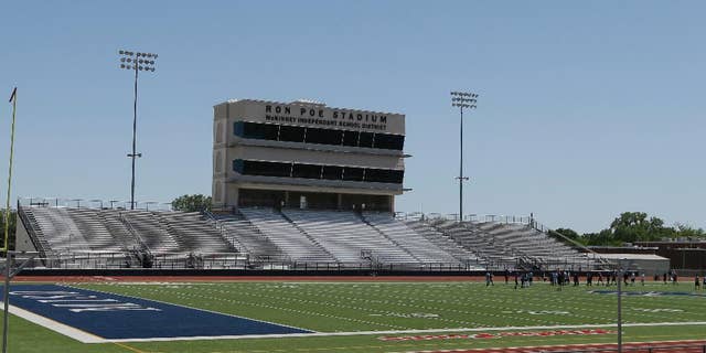 FILE - In this April 28, 2016, file photo, middle schoolers use the field in Ron Poe Stadium in McKinney, Texas. Voters in McKinney Independent School District approved a bond issue Saturday, May 7, 2016, to build a new high school football stadium. (AP Photo/LM Otero, File)
