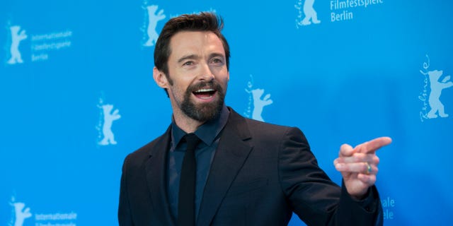 FILE - In this Saturday, Feb. 9, 2013 file photo, actor Hugh Jackman poses at the photo call of the film Les Miserables at the 63rd edition of the Berlinale, International Film Festival in Berlin. Police say 47-year-old Kathleen Thurston is charged with stalking Jackman after approaching him, crying and shouting, and throwing a razor at the Australian actor while he was working out at a gym in New York, on Saturday, April 13, 2013. (AP Photo/Gero Breloer, File)
