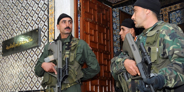 Jan. 17: Soldiers guard the office of the Tunisian President in Tunis.