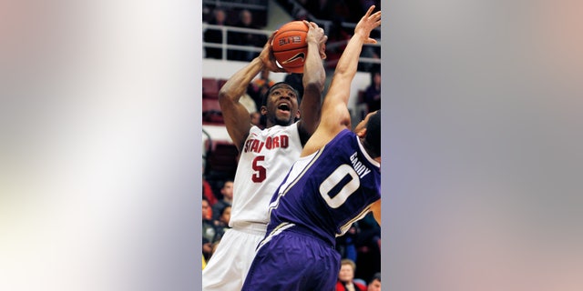 Stanford's Chasson Randle shoots over Washington's Abdul Gaddy during the first half of an NCAA college basketball game, Saturday, Jan. 12, 2013 in Berkeley, Calif. (AP Photo/George Nikitin)