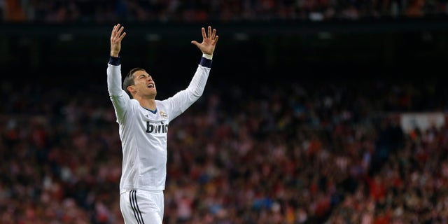 Real Madrid's Cristiano Ronaldo reacts during the Copa del Rey final soccer match between Atletico de Madrid and Real Madrid at the Santiago Bernabeu stadium in Madrid, Spain, Friday, May 17, 2013. (AP Photo/Daniel Ochoa de Olza)