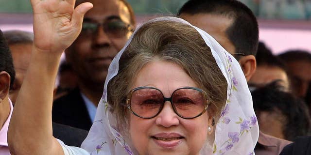 FILE - In this Jan. 20, 2014 file photo, Bangladesh's former Prime Minister and opposition Bangladesh Nationalist Party (BNP) leader Khaleda Zia, waves as she arrives for a public meeting in Dhaka, Bangladesh. A Bangladesh court issued an arrest warrant Wednesday for the ex-Prime Minister in two graft cases after she failed to appear in court for the fourth time. (AP Photo/A.M. Ahad, File)