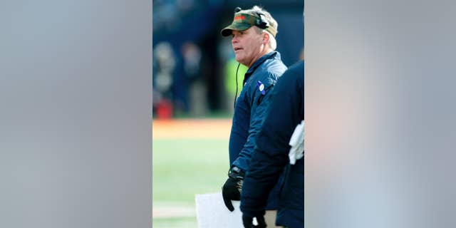 Illinois head coach Tim Beckman stands on the sidelines during the third quarter of an NCAA football game against Iowa Saturday, Nov. 15, 2014, at Memorial Stadium in Champaign, Ill. (AP Photo/Bradley Leeb)