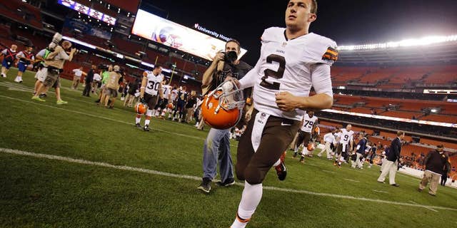 Cleveland Browns quarterback Johnny Manziel (2) runs off the field after a 33-14 loss to the St. Louis Rams in a preseason NFL football game Saturday, Aug. 23, 2014, in Cleveland. (AP Photo/Tony Dejak)