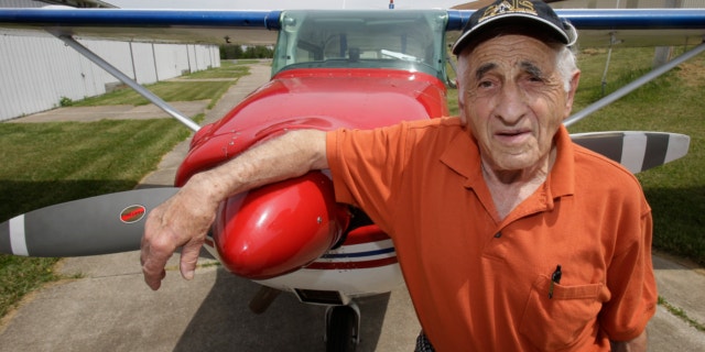 May 30, 2013: John Lawton poses by his Cessna 172 airplane in Wadsworth, Ohio. Lawton will attempt to make 90 flying passages across the U.S.-Canadian border.