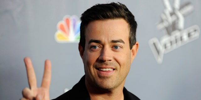 Television personality and "The Voice" host Carson Daly arrives at the Season 4 premiere screening in Los Angeles, California March 20, 2013.