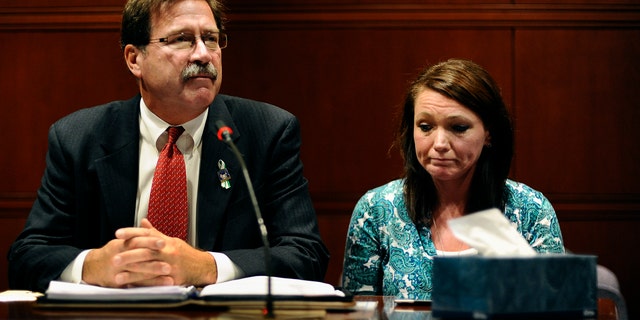 Bill Sherlach, husband of Sandy Hook Elementary School shooting victim Mary Sherlach, and Nicole Hockley, mother of victim Dylan Hockley, speak before the Task Force on Victim Privacy and the Publics Right To Know, Wednesday, Oct. 30, 2013, in Hartford, Conn. They told the panel they don't want the 911 tapes from that day released to the public.