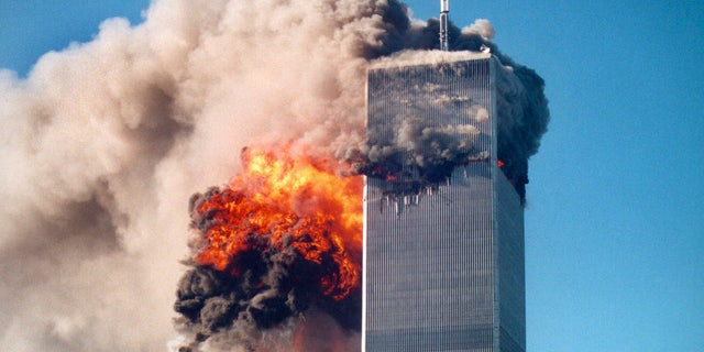 This photo by Roberto Robanne, provided in New York by the National September 11 Memorial & Museum, included in their "September 11 Attacks Timeline," shows the impact of one of the airplanes during the World Trade Center attacks in New York, Sept. 11, 2001. (AP/National September 11 Memorial & Museum)