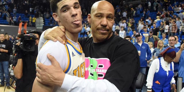 Mar 4, 2017; Los Angeles, CA, USA; Lavar Ball embraces his son UCLA Bruins guard Lonzo Ball (2) after the game against the Washington State Cougars at Pauley Pavilion. Mandatory Credit: Richard Mackson-USA TODAY Sports