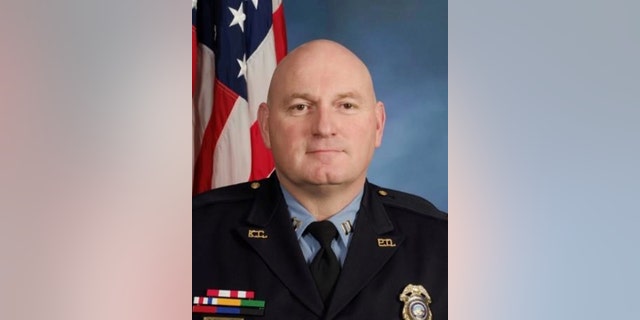 This undated photo provided by the Kansas City, Kan., Police Department show police Captain Robert Melton. A suspect in a drive-by shooting fatally shot Melton on Tuesday, July 19, 2016, as the officer was sitting in his patrol car, police said. (Kansas City, Kan. Police Department via AP)