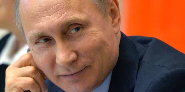 Russian President Vladimir Putin attends a meeting with members of the Legislative Council in St. Petersburg, Russia, on April 29, 2016. (The Associated Press)