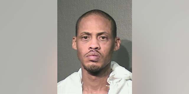 Kenneth Wayne Lockings Jr., 46, is accused of 'nearly' decapitating girlfriend with samurai sword.