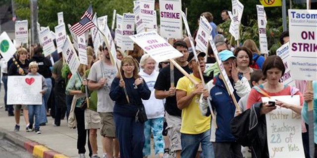 Wednesday, Sept. 14, 2011: Striking teachers picket outside Jason Lee Middle School in Tacoma, Wash.