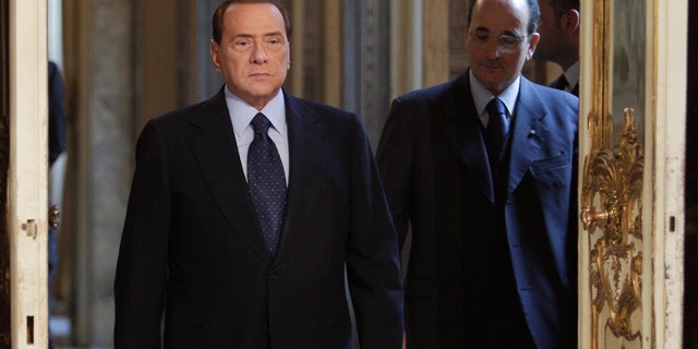 March 14: Italian premier Silvio Berlusconi arrives to meet European Commission president Jose Manuel Barroso, not in photo, at Palazzo Chigi in Rome. (AP)