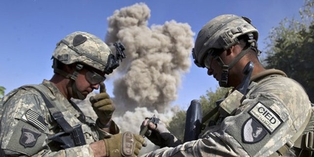 Oct. 25: U.S. soldiers blow up a building they believe the Taliban may use in Kandahar, Afghanistan.