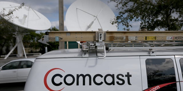 POMPANO BEACH, FL - FEBRUARY 13: A Comcast truck is seen parked at one of their centers on February 13, 2014 in Pompano Beach, Florida. Today, Comcast announced a $45-billion offer for Time Warner Cable. (Photo by Joe Raedle/Getty Images)