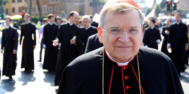 FILE - This May 13, 2012 file photo shows Cardinal Raymond Leo Burke, of the United States, taking part in an anti-abortion march in Rome. American Cardinal Raymond Burke, a fervent opponent of abortion and gay marriage, was removed by Pope Francis from another top Vatican post on Saturday. The removal of Burke as head of the Holy See's supreme court was widely expected in church circles. (AP Photo/Riccardo De Luca, File)