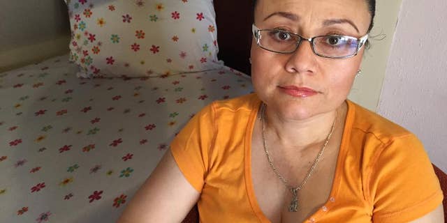 In this Thursday, July 30, 2015 photo, Rosa Robles Loreto sits in her small room at Southside Presbyterian Church in Tucson, Ariz., where she has taken sanctuary from deportation for a year. Robles Loreto, 42, says she is not leaving the church until the government assures her she will not be deported. (AP Photo/Astrid Galvan,File)